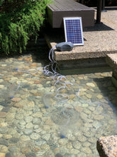 Load image into Gallery viewer, Solariver Solar Pond Aerator being used to aerate a pond..
